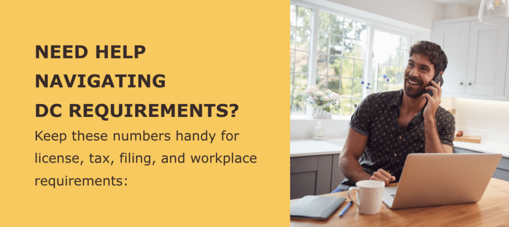 “Small business owner reviewing DC compliance requirements on a laptop”